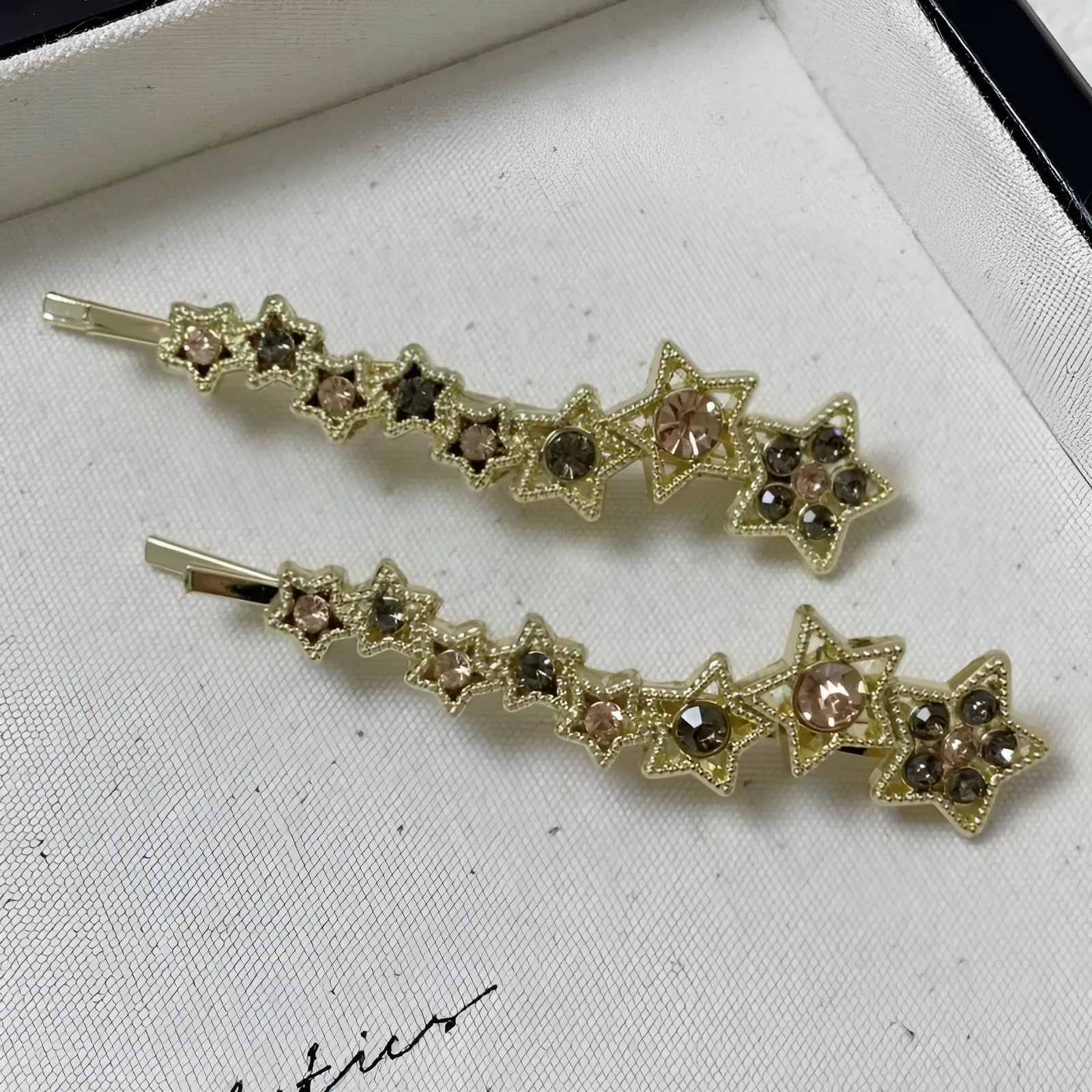 Gold-coloured alloy hair barrette with rhinestone, star, and word decoration in Korean style.
