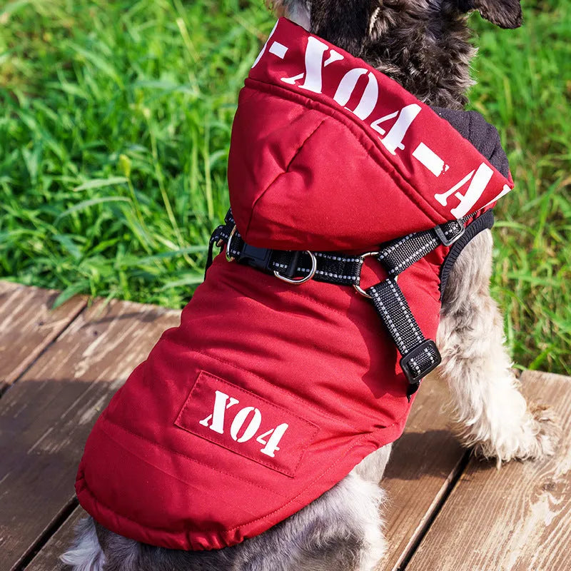 Red hooded dog winter jacket with fleece lining on a small dog outdoors.