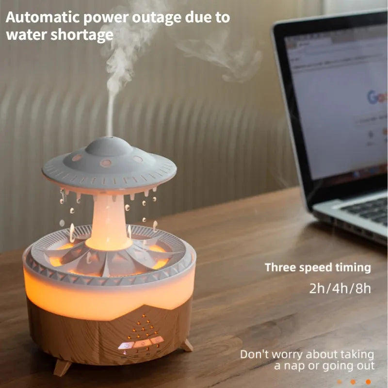 White UFO-shaped humidifier with water droplets creating mist and rain sounds