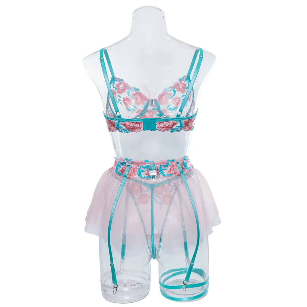 Pink women's mesh pettiskirt bikini set with embroidery detail on polyester fabric.