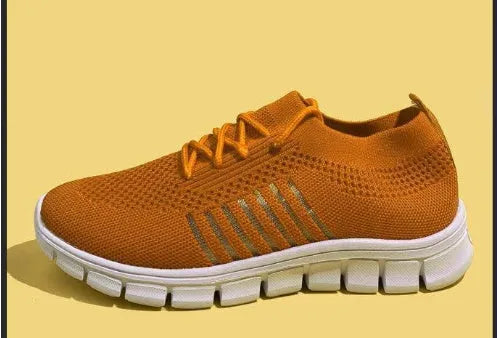 High-cut lace-up platform sneaker in a casual style with a breathable fabric upper and flat rubber sole.