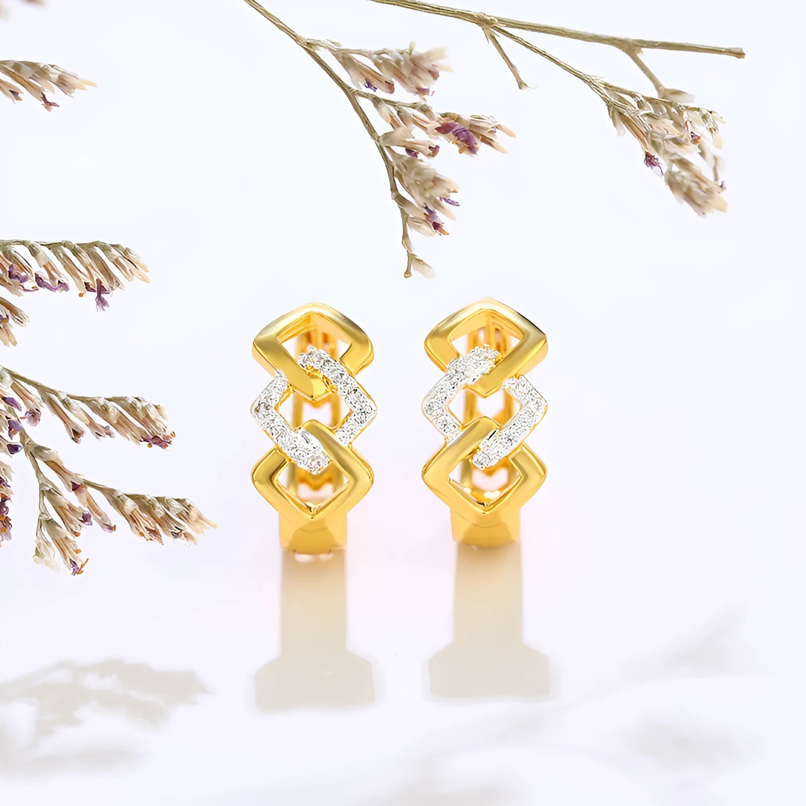 Gold tone geometric hollow-out drop earrings with colour separation clip design