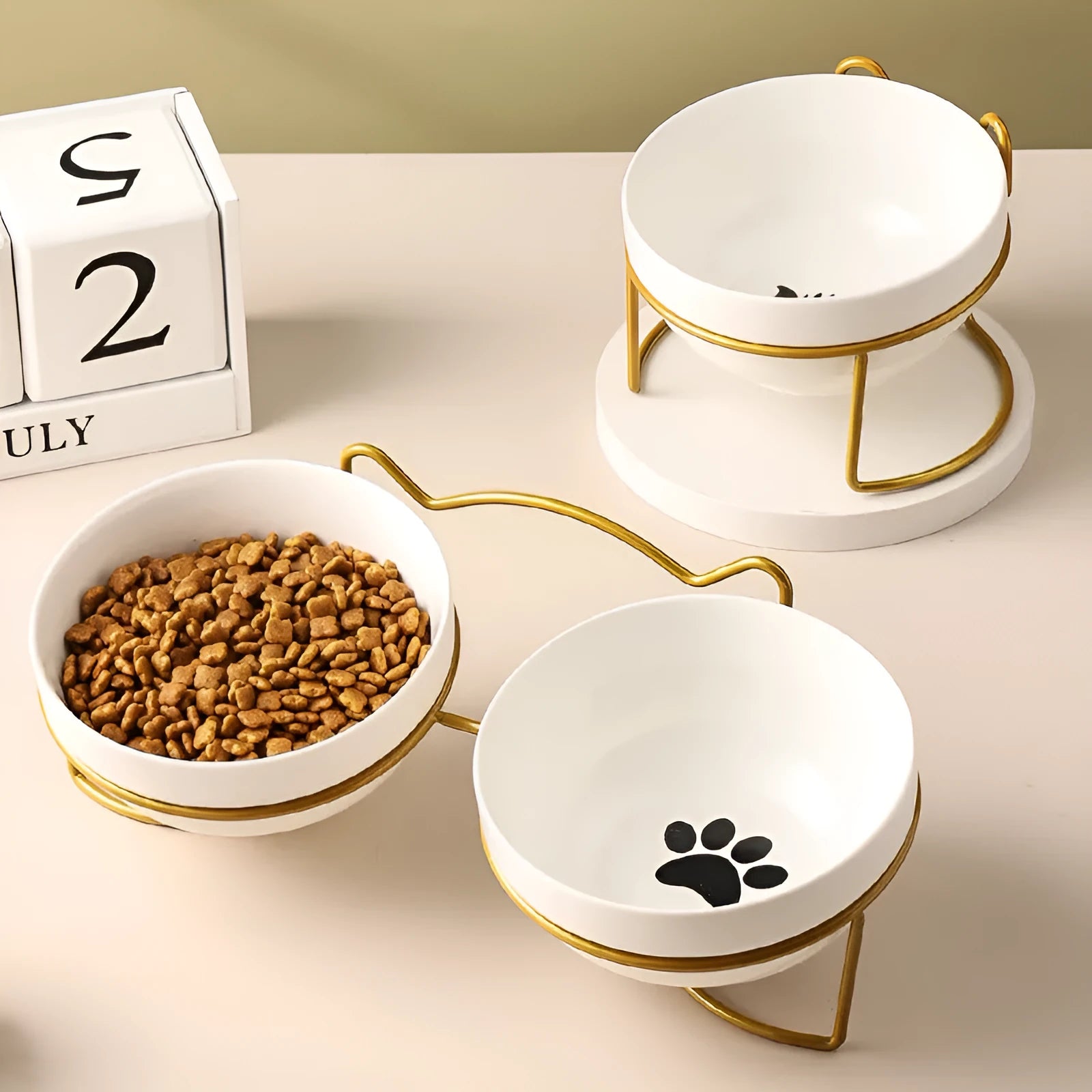 Ceramic cat bowl with iron frame stand in cat footprints pattern