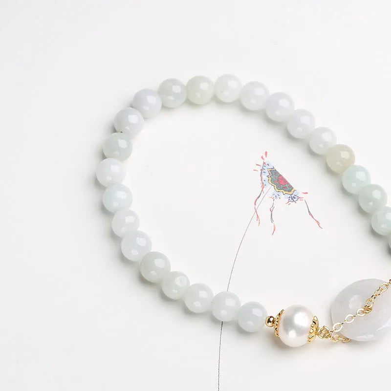 Handcrafted jade pearl bracelet with peace buckle closure in traditional Chinese style