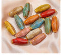 Ceramic bullet beads for jewellery making in eight glaze colours including pink, yellow, blue, red, coffee, green, orange, and mixed