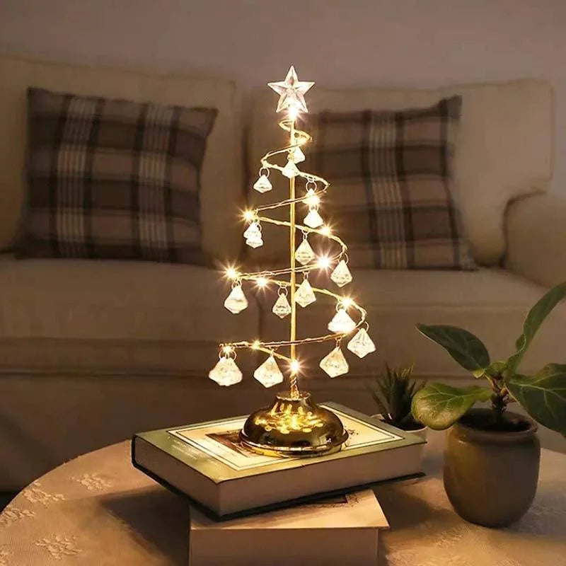 Gold crystal Christmas tree LED light with warm glow, star topper, 33cm tall, on a tabletop