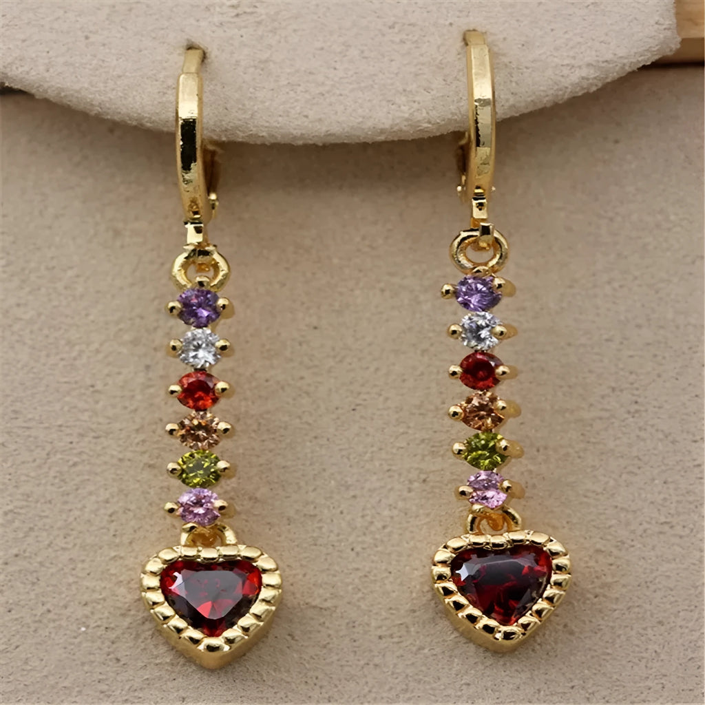 Pair of women's heart-shaped alloy earrings with electroplated gold or silver finish.