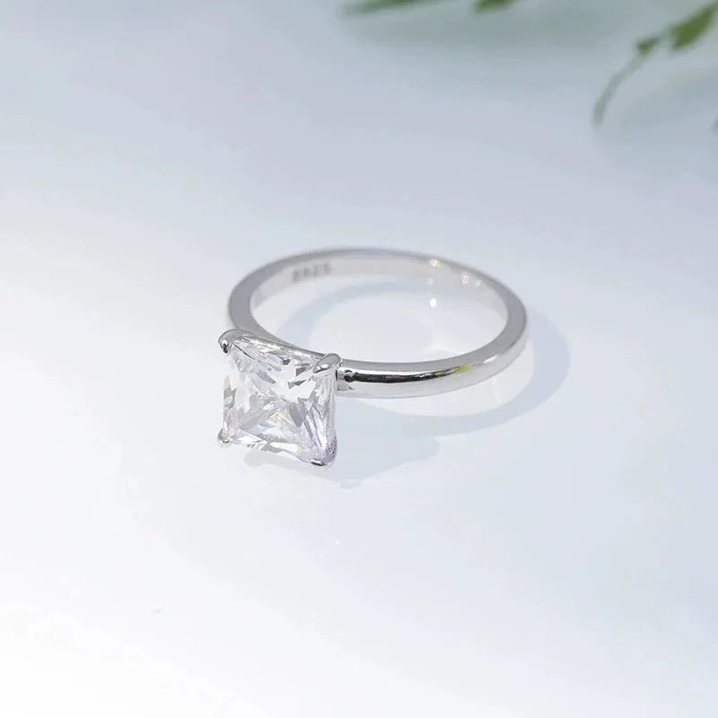 Sterling silver geometric women's ring with a round zirconia stone in silver, gold, or rose gold finish.