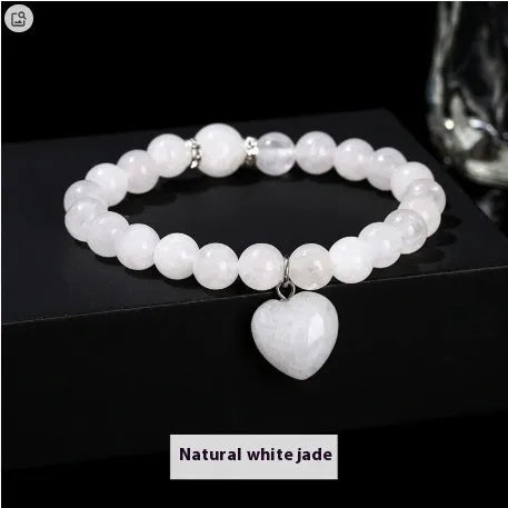 Handmade women's bracelet with geometric pendant and round natural crystal beads.