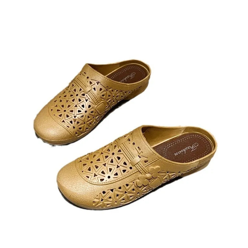 Women's apricot PVC half slippers with flat toe box and hollow out fairy style design.