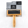 Pet grooming bamboo wood air cushion needle comb in original bamboo colour with steel pins, shown on a table