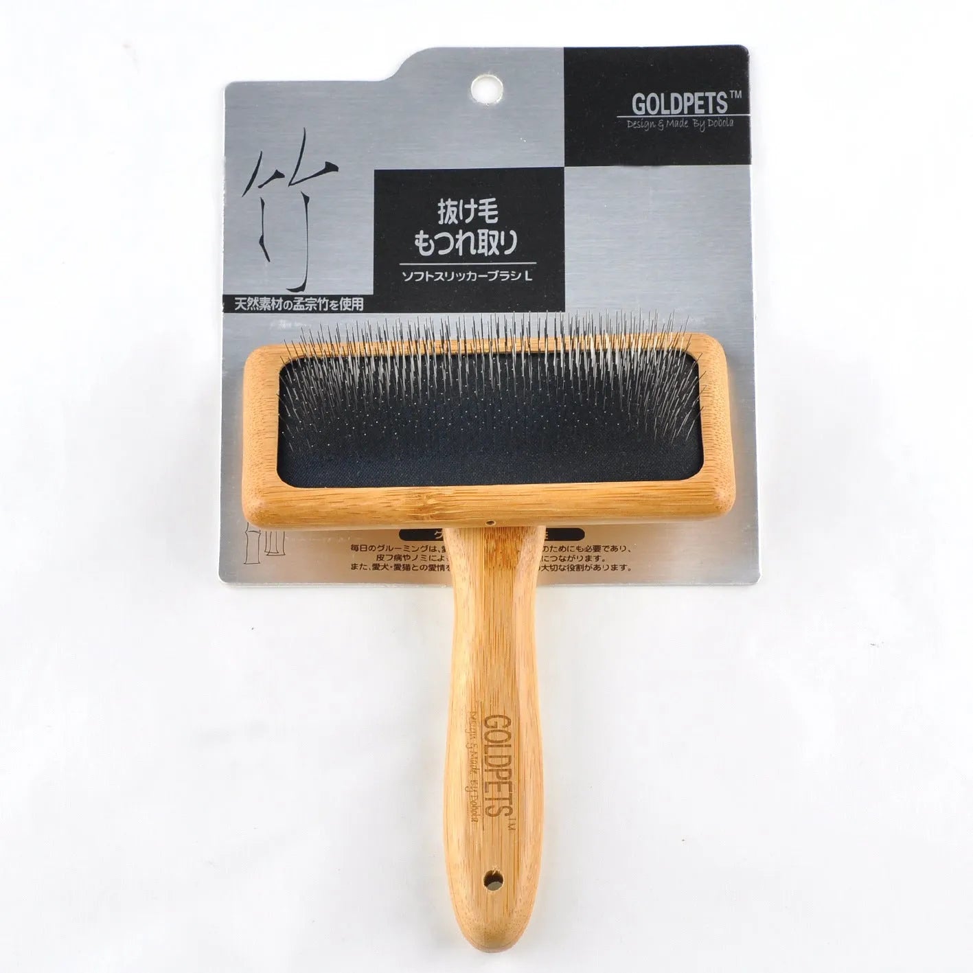 Pet grooming bamboo wood air cushion needle comb in original bamboo colour with steel pins, shown on a table