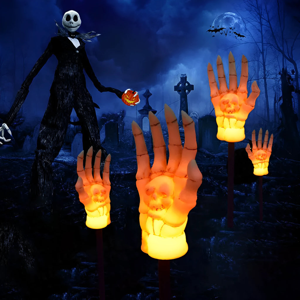 Halloween ghost hand solar light in garden setting with warm white glow, plastic IP55 waterproof construction