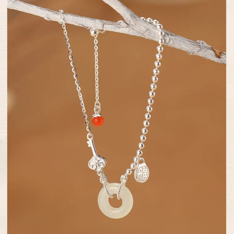 Women's Hetian jade bracelet with 925 silver peace buckle charm in traditional Chinese design
