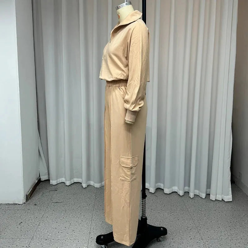 Women's light camel polyester two-piece work set with lapel top and wide-leg trousers on hanger