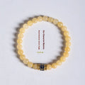 Women's hand-woven topaz bracelet with mantra barrel beads and square jade accents