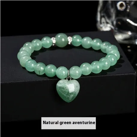 Handmade women's bracelet with geometric pendant and round natural crystal beads.