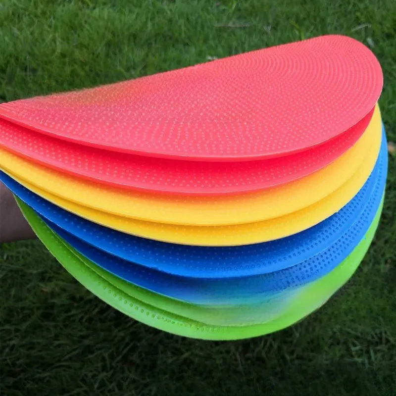 Soft circular football training target pad in bright colours measuring 23cm across