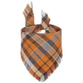 Classic plaid dog bandana with tassel edges in autumn colours of brown, green, orange, red, yellow.