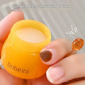 Vaseline lip balm pot in pomegranate or blueberry flavour with small application brush