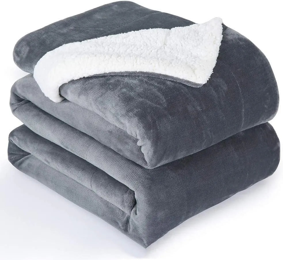 Grey and white flannel electric heating blanket with USB cable and temperature controls.