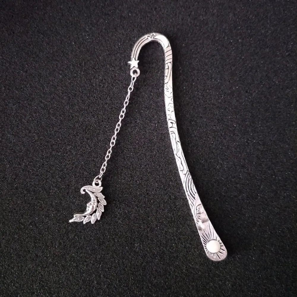 Retro five-pointed star metal bookmark with glowing elements in ancient silver finish