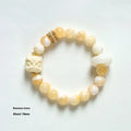 Hand-woven bracelet with 10mm round grey agate and mellite beads on a single strand.