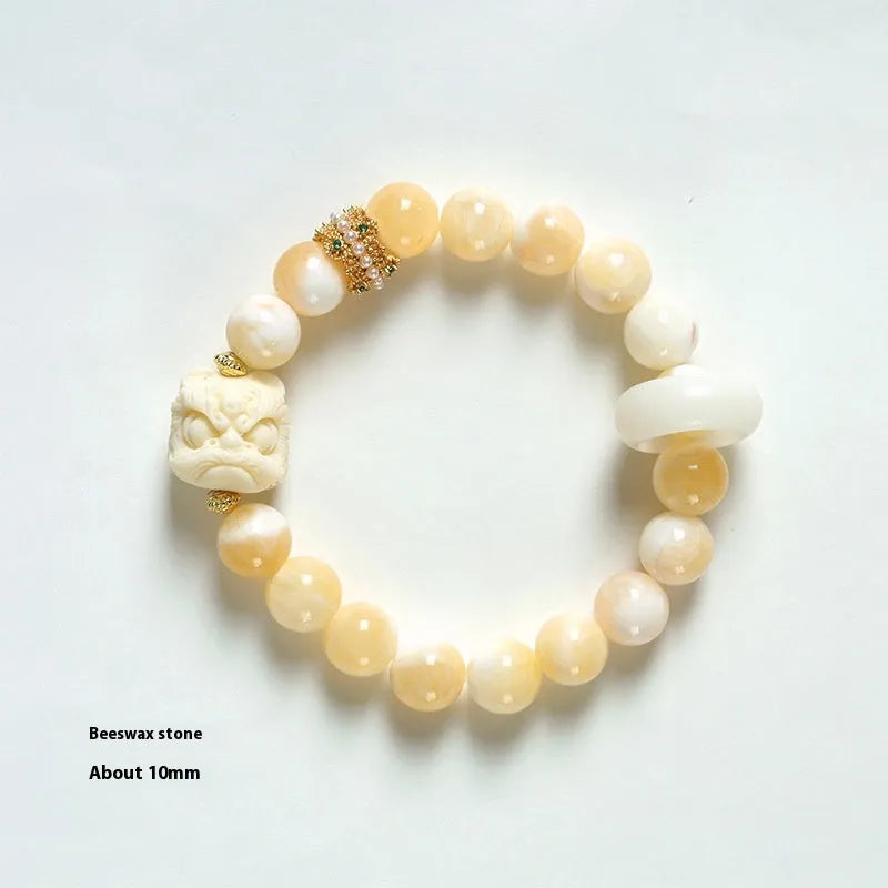 Hand-woven bracelet with 10mm round grey agate and mellite beads on a single strand.