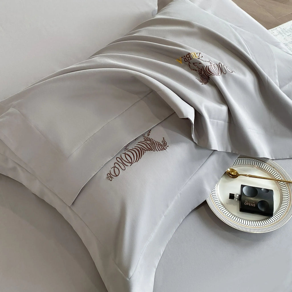 Solid colour pure cotton four-piece bedding set with light brushed finish on a bed in a modern bedroom