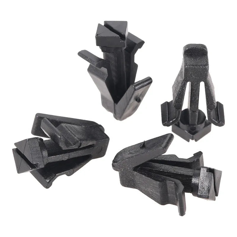Black plastic Nissan bumper and grille fastening clip, model 76882-0M060.