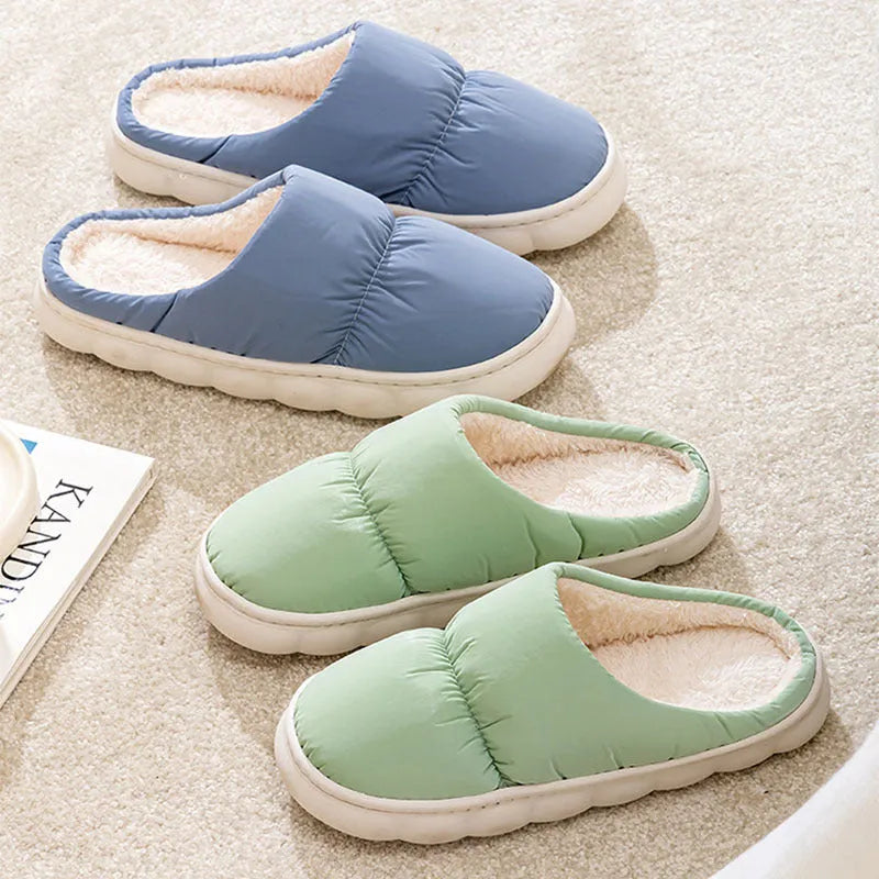 A pair of thick-soled down cotton slippers for men and women in a choice of colours, featuring a non-slip rubber sole.