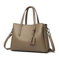 Cowhide leather women's shoulder handbag in khaki with multiple compartments and business styling