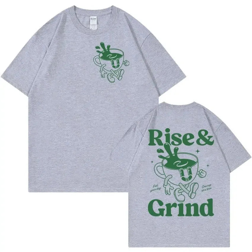 Man wearing a loose black linen t-shirt with a green 'Rise And Grind Green Coffee' cartoon graphic print.