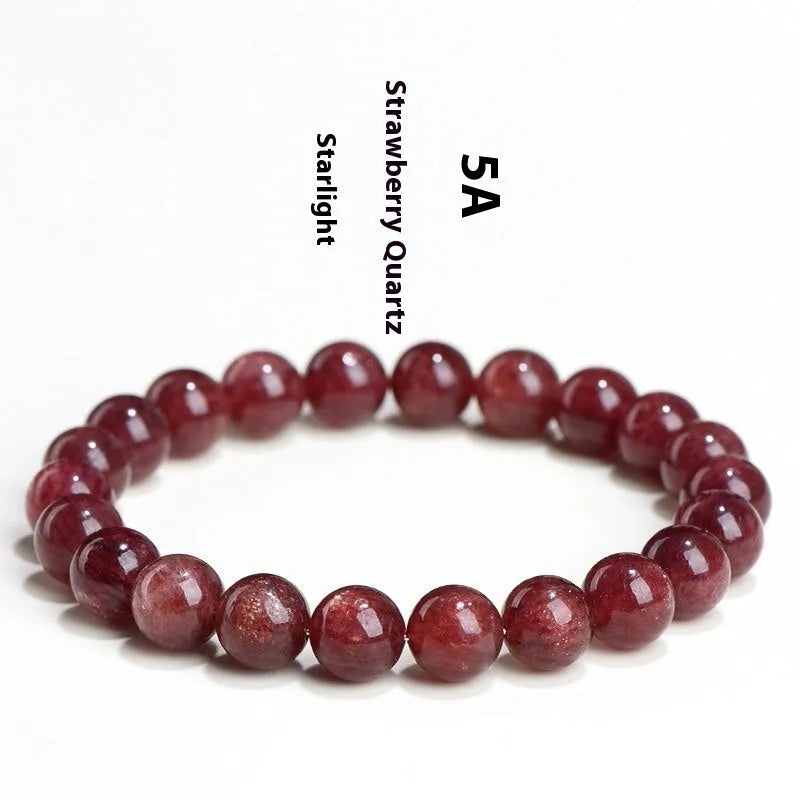 A stretch bracelet with round, pink strawberry quartz beads on an elasticated cord, shown in different size options.