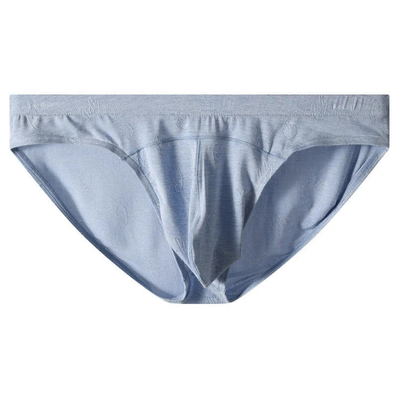 Women's low-waist modal briefs in jacquard knit, showing colour options: dark grey, green, sky blue, pink, and colourful blue.