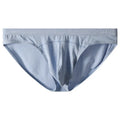 Women's low-waist modal briefs in jacquard knit, showing colour options: dark grey, green, sky blue, pink, and colourful blue.