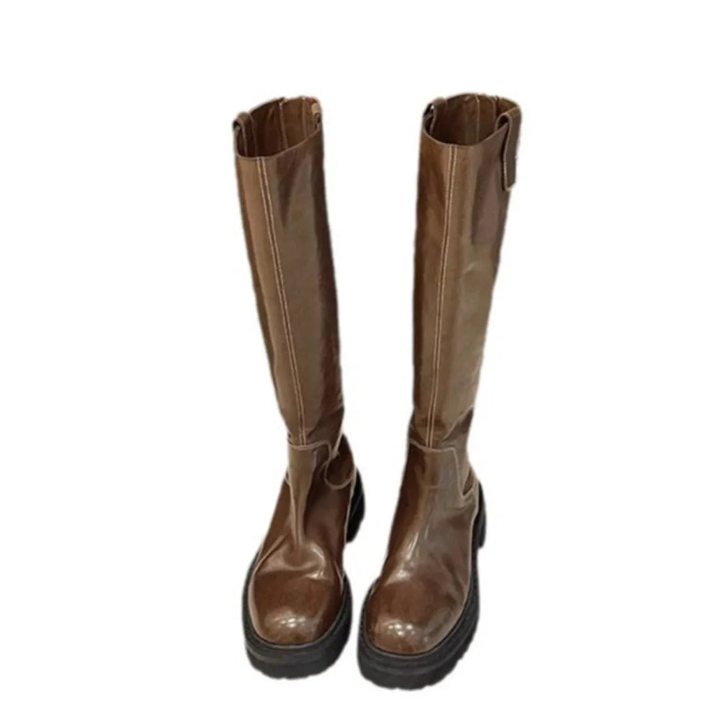 Women's black knee-high knight boots with a chunky heel, round toe, and back zipper.