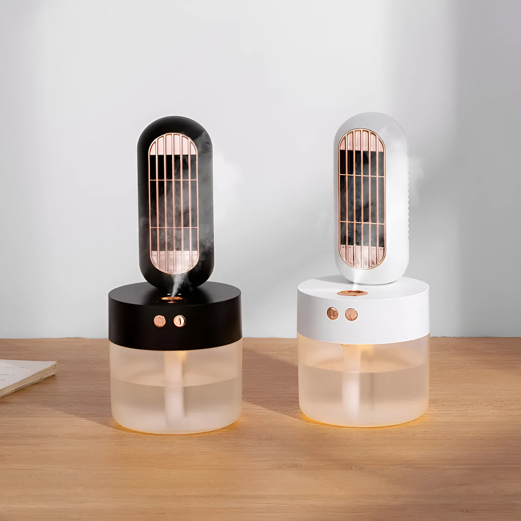 Small black and white humidifier fan with oscillating head on a table