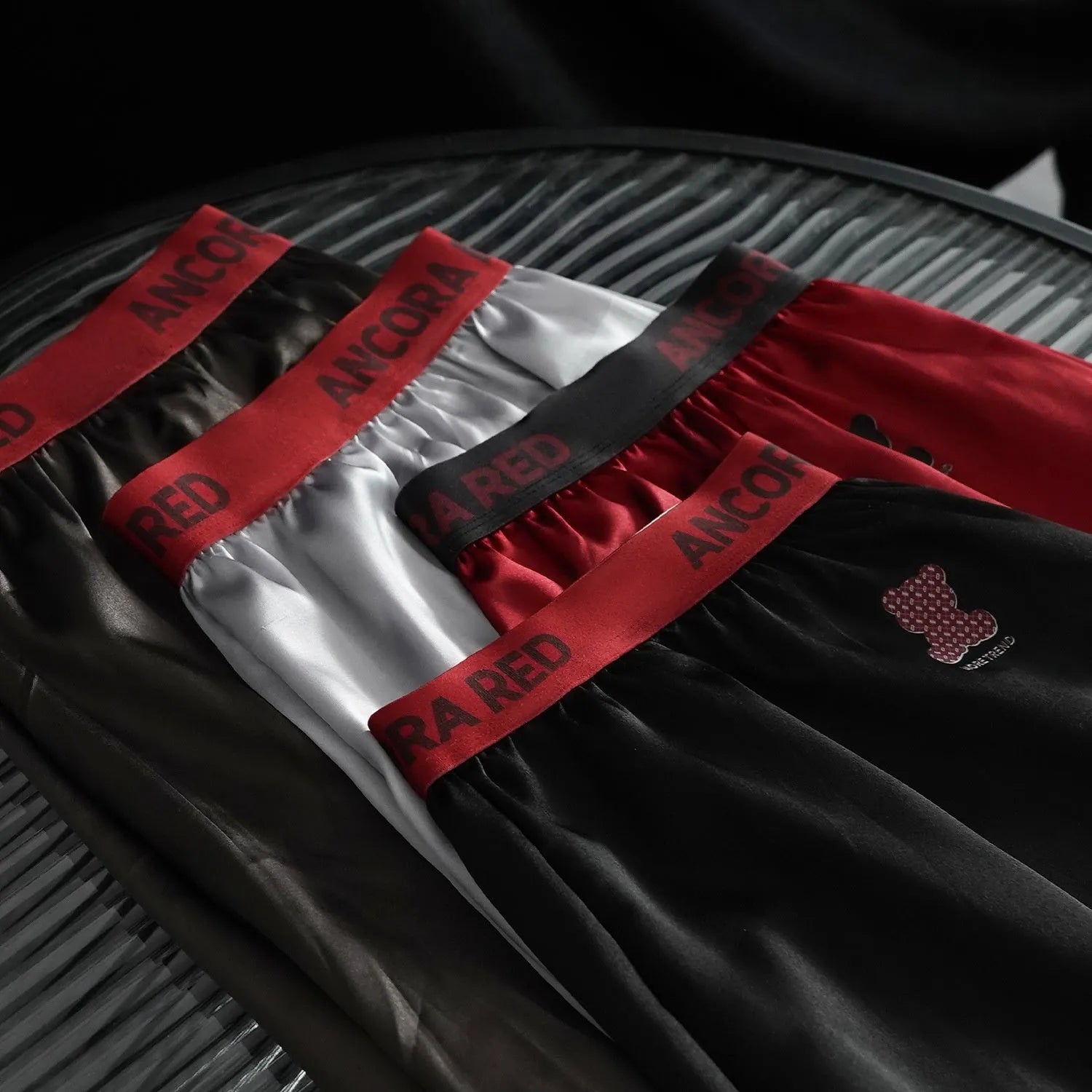 Men's solid colour boxer briefs in polyester knit fabric showing mid waist design