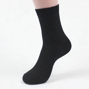 Pair of men's bamboo fibre business socks with small square pattern, shown in navy blue.