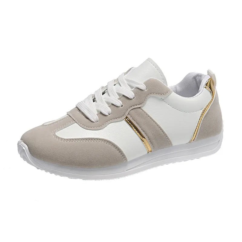 Women's casual flat sports shoes in grey with fabric canvas upper and PVC sole, low-top design