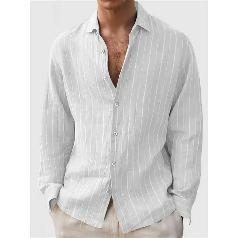 Man wearing a loose-fit, striped, short-sleeve cardigan shirt in a casual setting.
