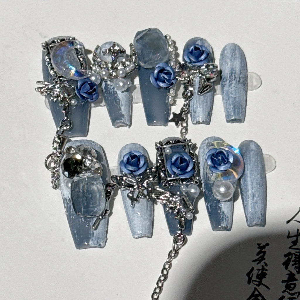 Blue plastic nail armour suit with rose and tulip patterns for evening wear.