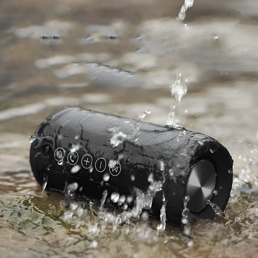 Black waterproof portable Bluetooth speaker with buttons for TF card, AUX, and Bluetooth playback.