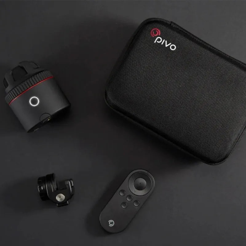 Matte black PIVO face tracking camera mounted on a surface with a smartphone attached.