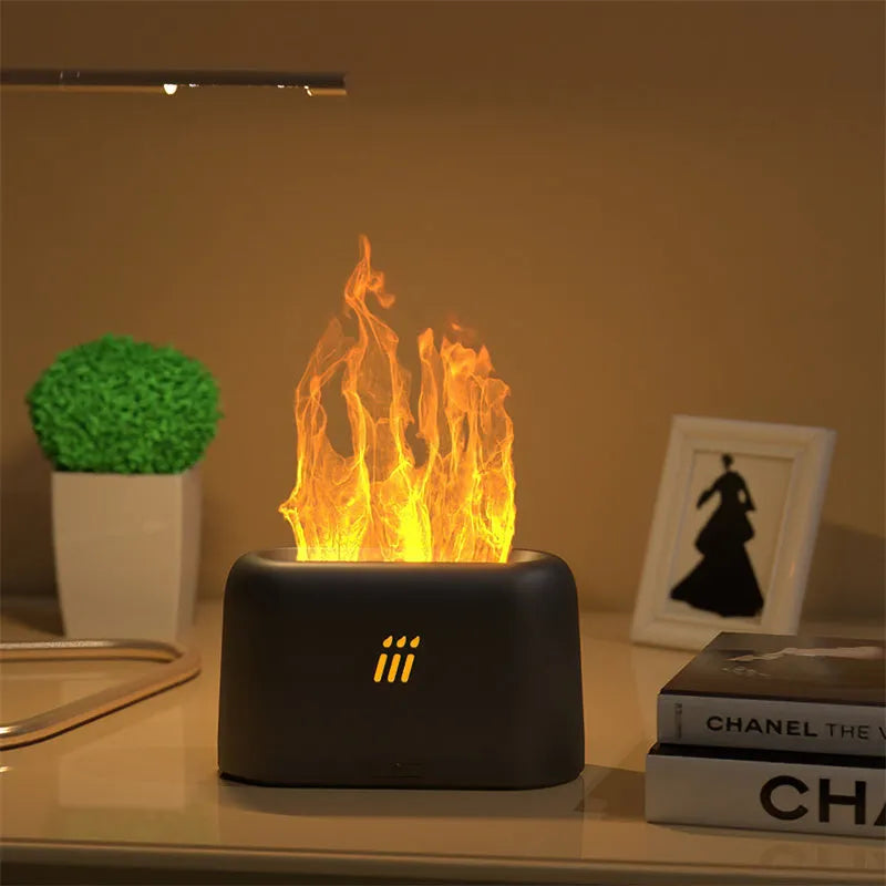 Black ultrasonic aroma diffuser humidifier with LED flame light effect on a wooden table