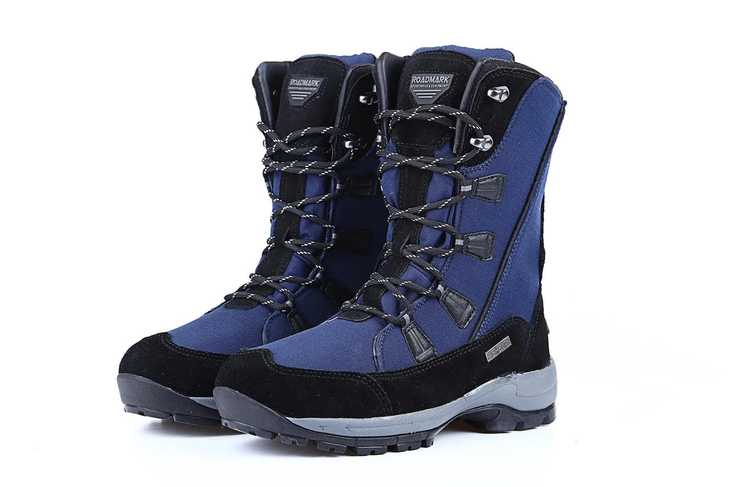 Women's black mid-calf snow boots with a round toe and genuine leather upper on a rubber sole.