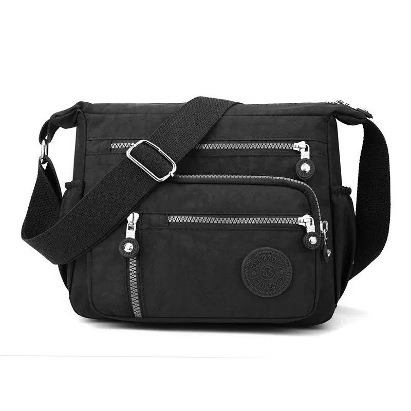 Nylon messenger shoulder bag in square vertical shape shown in light blue colour.