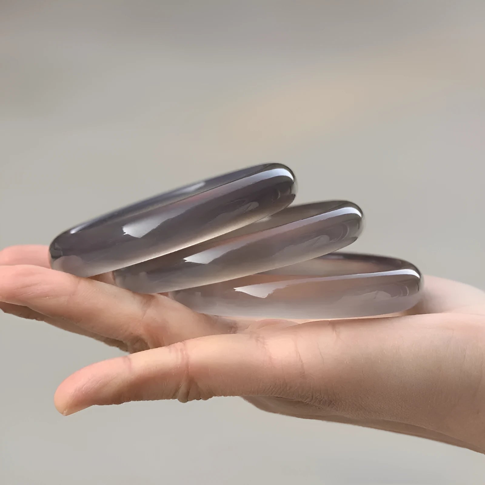 Dark grey Brazilian agate bracelet with iced chalcedony stones showing natural patterns on wrist