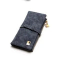Women's vertical long wallet in matte PU leather with a drawstring zip closure, shown in army green.
